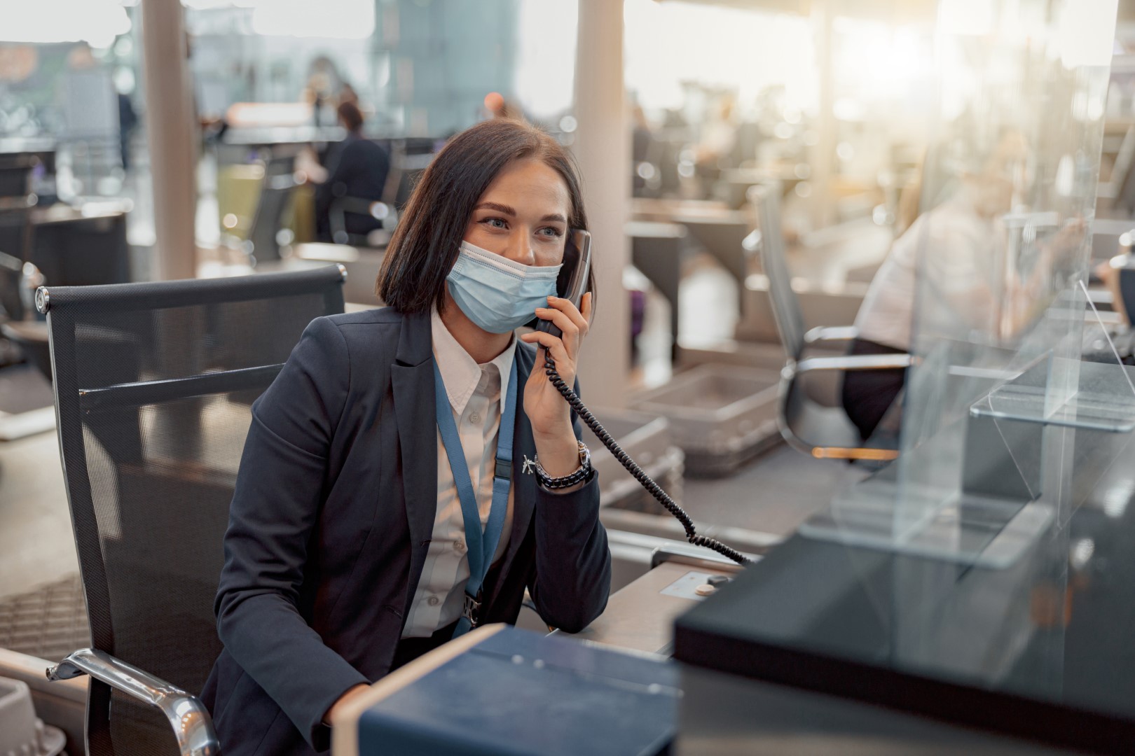 Woman working in the control service and talking on the phone